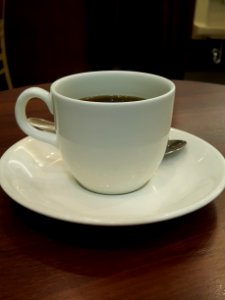 Coffee and white saucer