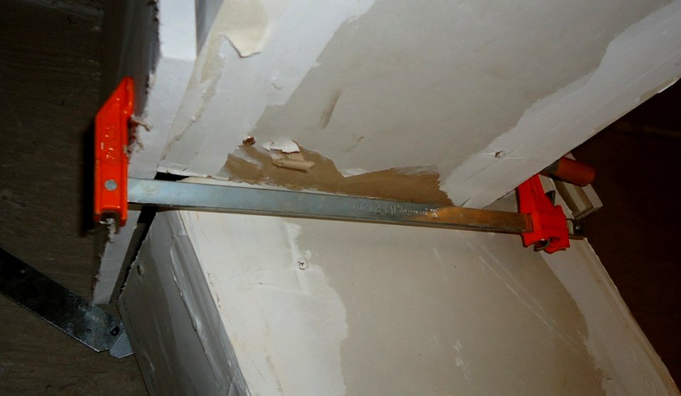 Clamp used to secure sheetrock to free hands to drill photo