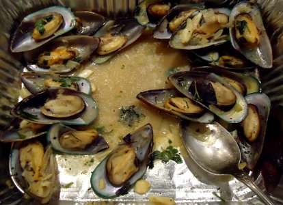 Clam dish in a silver pan at a party