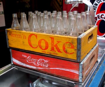 Coke Coca-Cola crate with old glas bottles photo