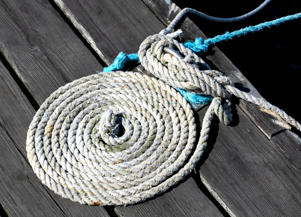 Coiled white mooring rope