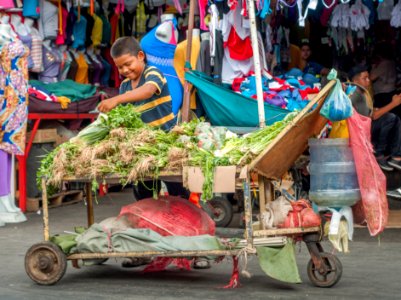 Child working selling vegetables in downtown Maracaibo photo