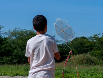 Child playing with a kite
