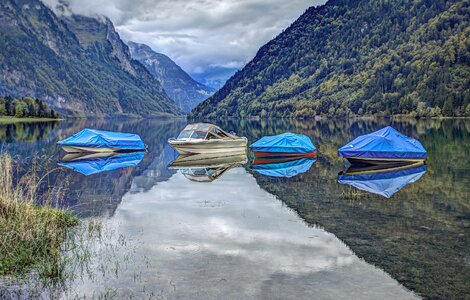 Motorboats reflection mountains photo