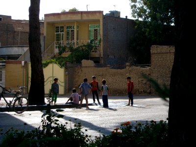 Children playing with water in 17 Shahrivar street rill - Nishapur 2