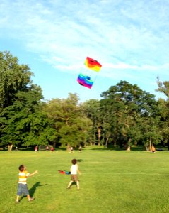 Children chasing a box kite Summer 2014 photo