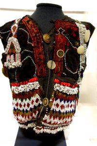 Child's vest, Indus Kohistan, Northwest Frontier Province, Pakistan, early to mid 20th century, cotton, silk, glass beads, mother-of-pearl, plastic buttons - Textile Museum of Canada - DSC00917