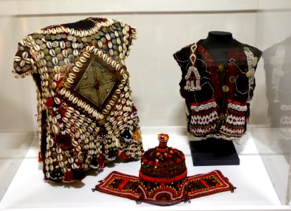 Child's tunic (Yomud Turkmen people, Northern Afghanistan), child's vest and hat (Indus Kohistan, Northwest Frontier Province, Pakistan), early to mid 20th century - Textile Museum of Canada - DSC00912