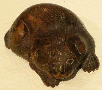 Crouching puppy netsuke, 19th-20th century, wood, Honolulu Museum of Art, 13896.1