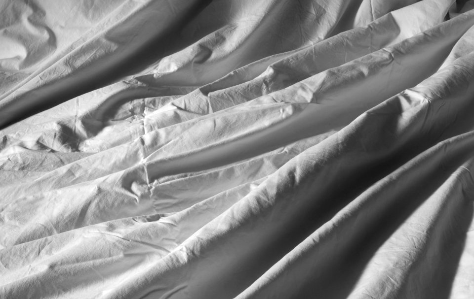 Crumpled duvet covered with a white cotton duvet cover 2