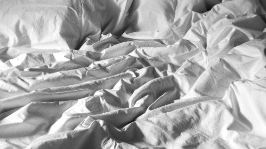 Crumpled duvet covered with a white cotton duvet cover 1