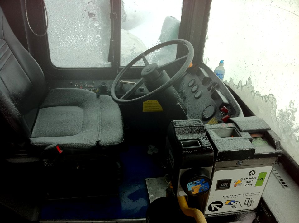 CTA bus seat and farebox covered in snow abandoned on feb 2 2011 chicago