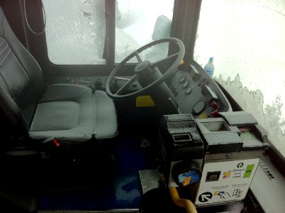 CTA bus seat and farebox covered in snow abandoned on feb 2 2011 chicago