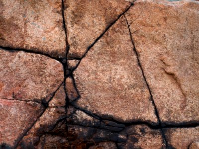 Cracks in granite cliff photo