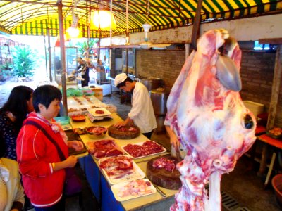 Cow carcase hanging in Haikou restaurant - 03