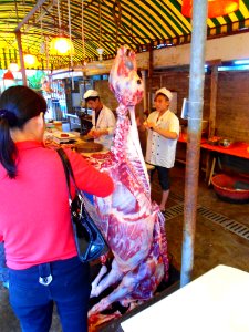 Cow carcase hanging in Haikou restaurant - 01 photo