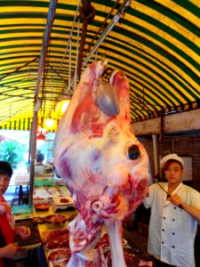 Cow carcase hanging in Haikou restaurant - 02
