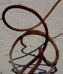 Curled rusty steel cable pic1