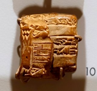 Cuneiform tablet with commodities, in envelope, Ur III Period, c. 2100-2000 BC - Harvard Semitic Museum - Cambridge, MA - DSC06156 photo