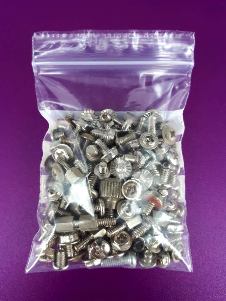 Computer screws in a zipper storage bag - 6 x 9 cm - on Purple plastic