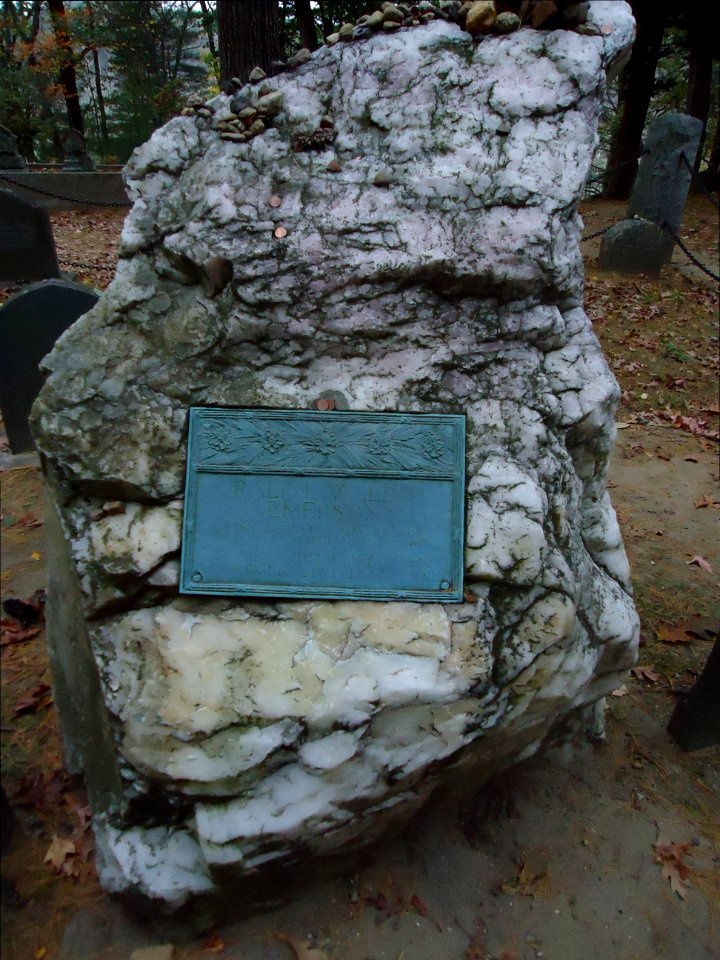 Concord Massachusetts gravesite of Ralph Waldo Emerson large rock with pennies and pebbles on it
