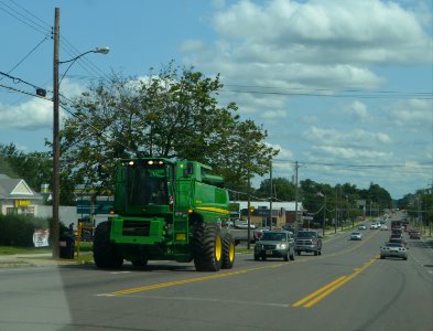 Combine harvester transiting on road