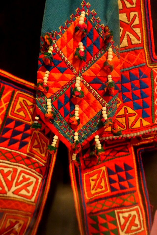 Costume, Lolo Hoa, Ha Giang, 1970, view 4, cotton, indigo, applique and embroidered patterns - Vietnamese Women's Museum - Hanoi, Vietnam - DSC03827