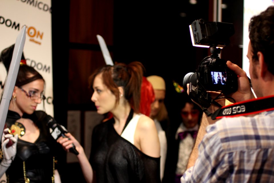 Cosplayers at Comicdom 2012 in Athens, Greece grant interviews to the MTV television channel 10