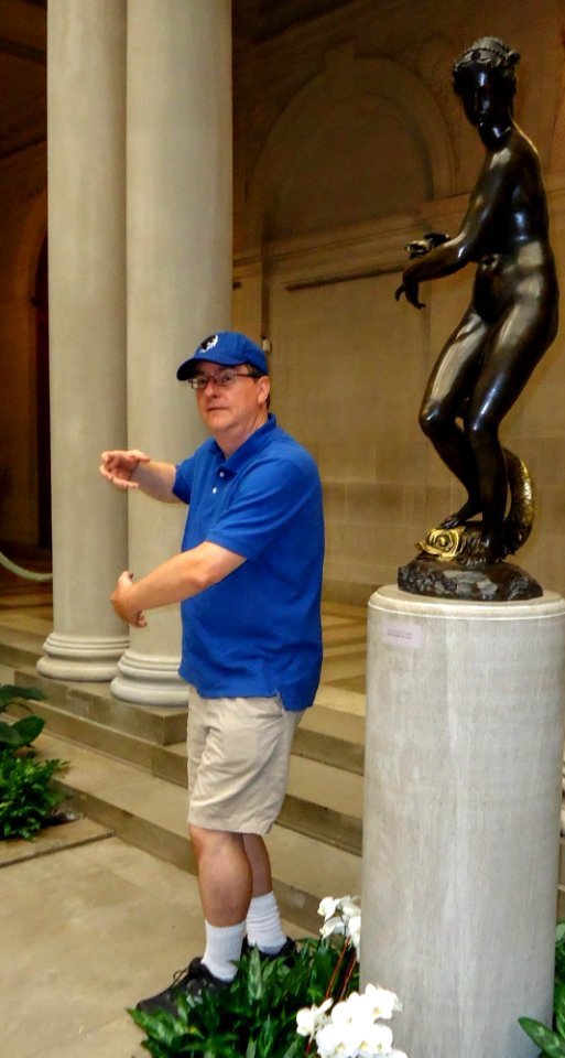 Copying statue pose in the indoor garden of the Frick Museum