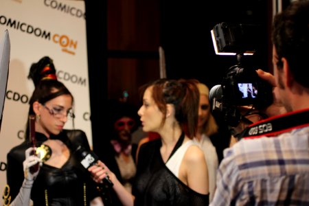 Cosplayers at Comicdom 2012 in Athens, Greece grant interviews to the MTV television channel 11