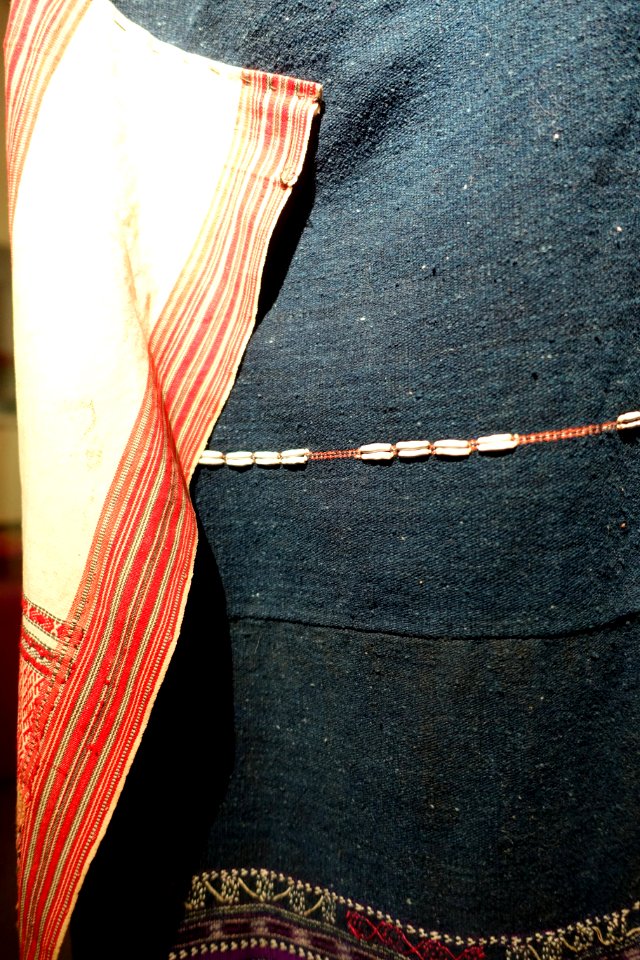 Costume, Bahnar, Binh Dinh, 1970, view 3, handmade cotton, natural dyes, ikat & woven patterns, shirt with stars and insect eyes, skirt with Job's Tears seeds- Hanoi, Vietnam - DSC03945