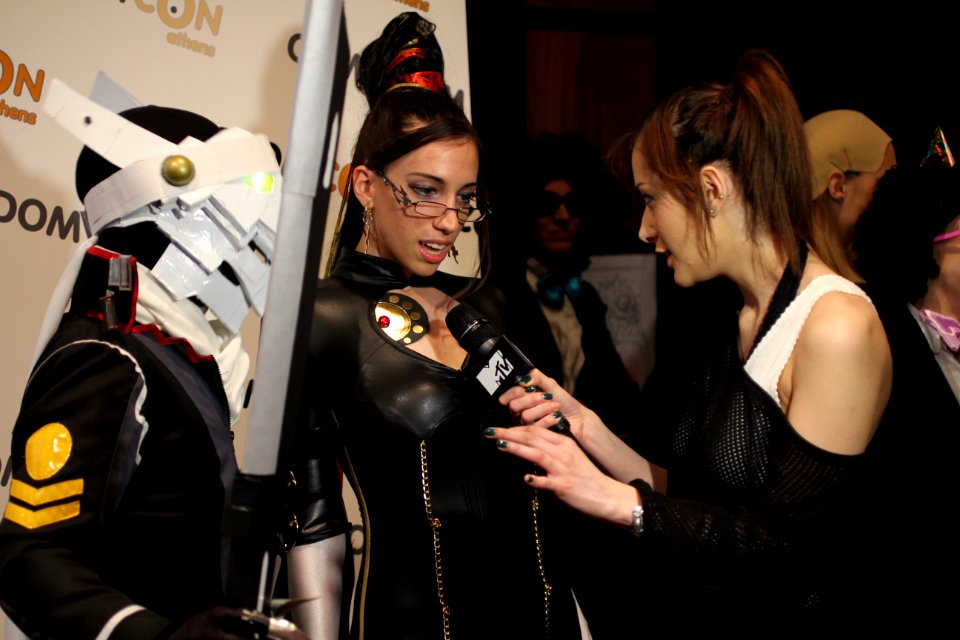 Cosplayers at Comicdom 2012 in Athens, Greece grant interviews to the MTV television channel 34