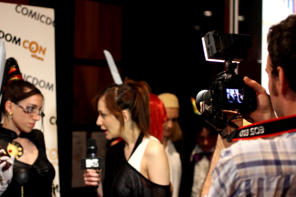 Cosplayers at Comicdom 2012 in Athens, Greece grant interviews to the MTV television channel 08