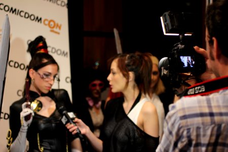 Cosplayers at Comicdom 2012 in Athens, Greece grant interviews to the MTV television channel 13