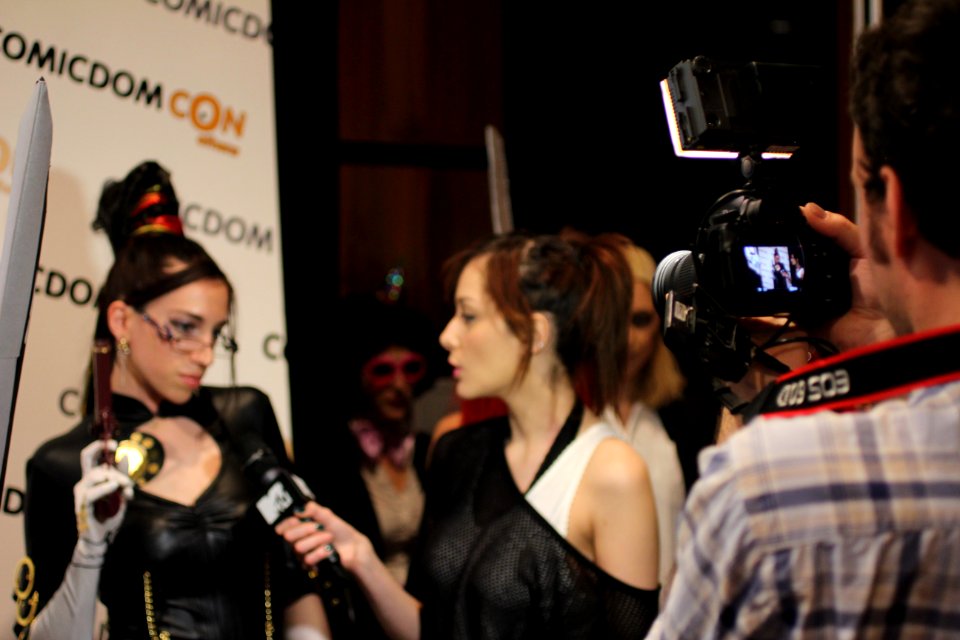 Cosplayers at Comicdom 2012 in Athens, Greece grant interviews to the MTV television channel 12