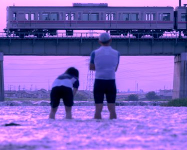 Couple of cyclists and Keio 7000 series