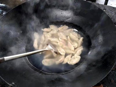 Cooking with a wok on an outdoor stove 3 photo