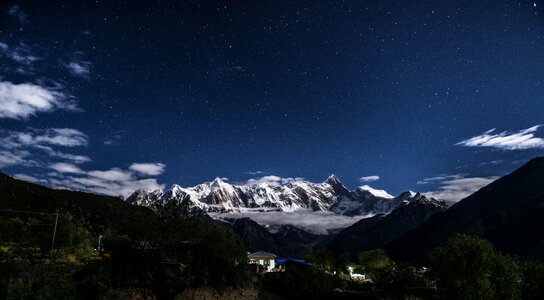 Snow capped stars night photo