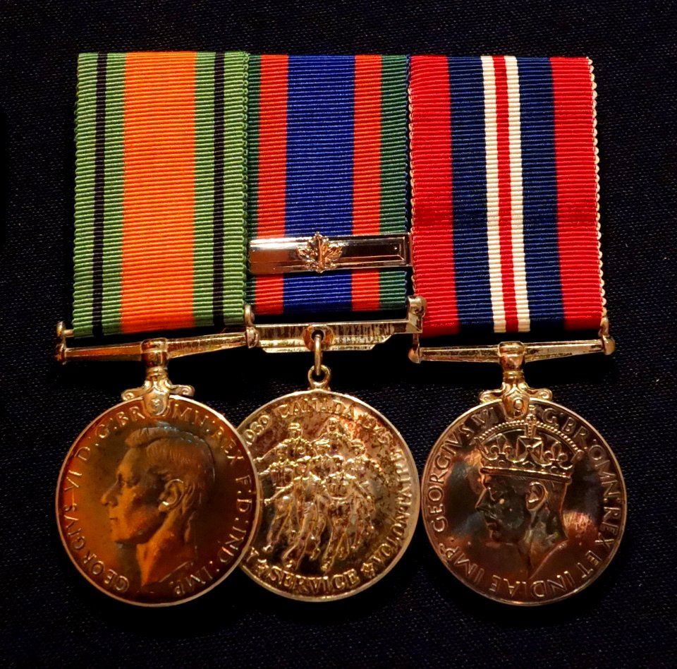 Defence Medal, Canadian Volunteer Service Medal with Clasp, 1939-1945 War Medal, awarded to Wing Commander Lawrence L. MacKinnon, 405 Squadron RCAF - Glenbow Museum - DSC00625