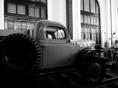 Truck old black and white train station photo
