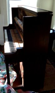 Demolition of upright Knabe piano in living room