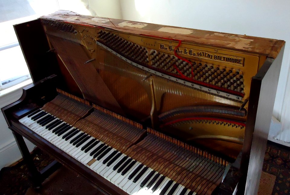 Demolition of upright Knabe piano top panel removed