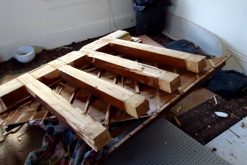 Demolition of upright Knabe piano beams still attached