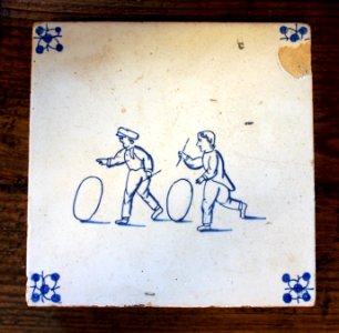 Delftware tile depicting 2 children playing