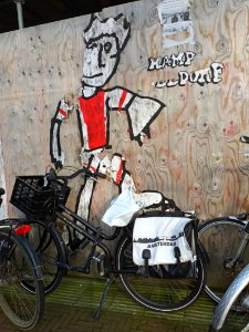 Dddddreftgr WIKI - stencil art, glued on the building fence in Amsterdam, photo of february 2020 by Fons Heijnsbroek