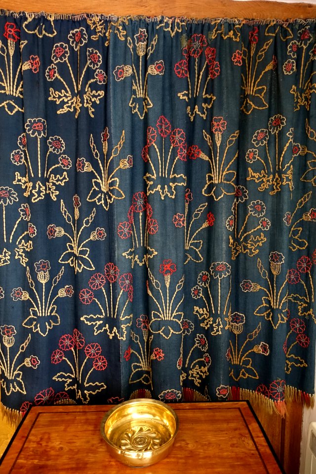 Daisy wall hangings, designed by William Morris for Red House, worked by William and Jane Morris, 1860, couched wools on wool serge - Kelmscott Manor - Oxfordshire, England - DSC09983
