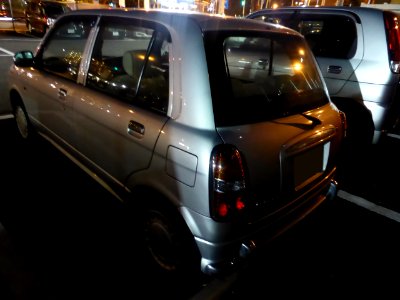 Daihatsu MIRA Gino (L700S) at night rear