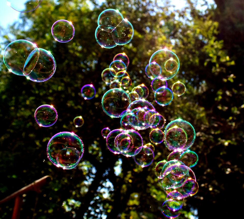Make soap bubbles mirroring soapy water