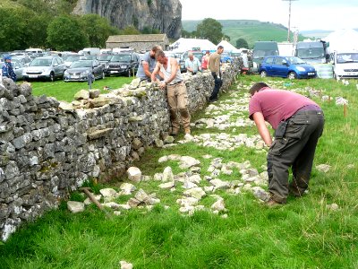 Dry stone wall building 09
