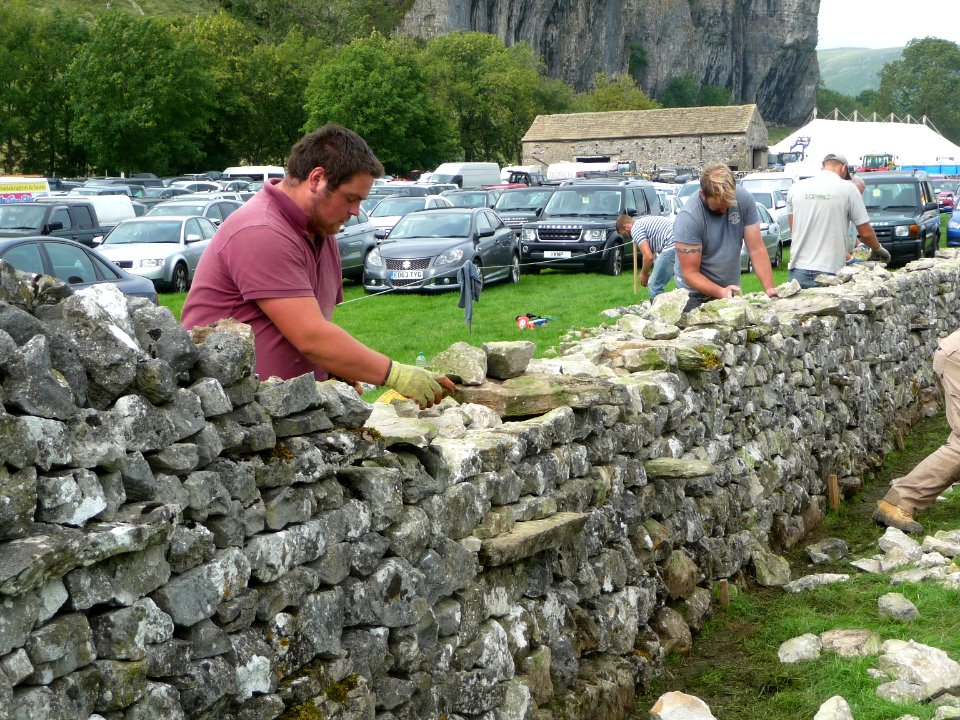 Dry stone wall building 03